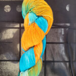 A skein of orange/sky blue dyed sock yarn