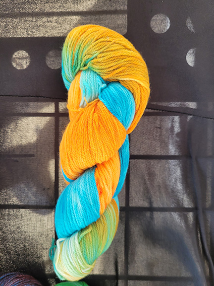 A skein of orange/sky blue dyed sock yarn